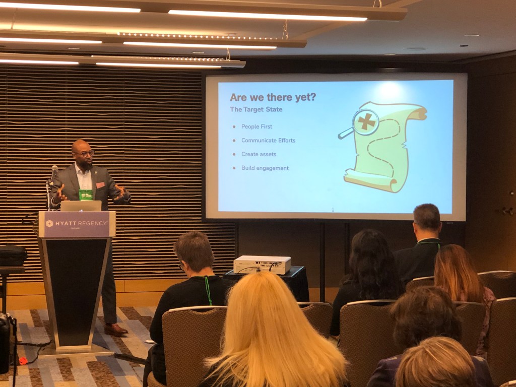 Antonio Mannings, Head of DEI, speaking at an annual conference.